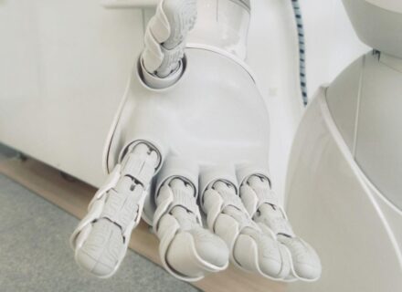Robot hand extended — the cost of a custom AI chatbot