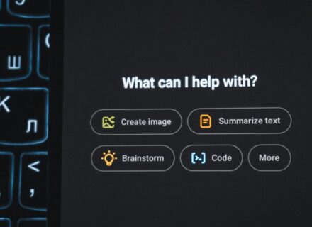 Backlit keyboard with an AI assistant interface glowing on screen