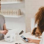 Customer paying at a store checkout — eCommerce order flow