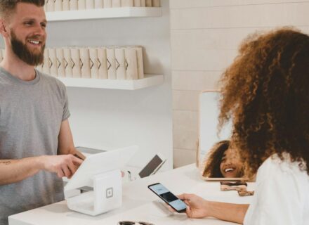 Customer paying at a store checkout — eCommerce order flow