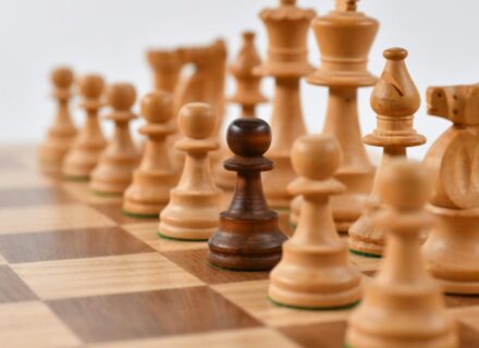 Chess pieces with one dark pawn among light ones — comparing AI models