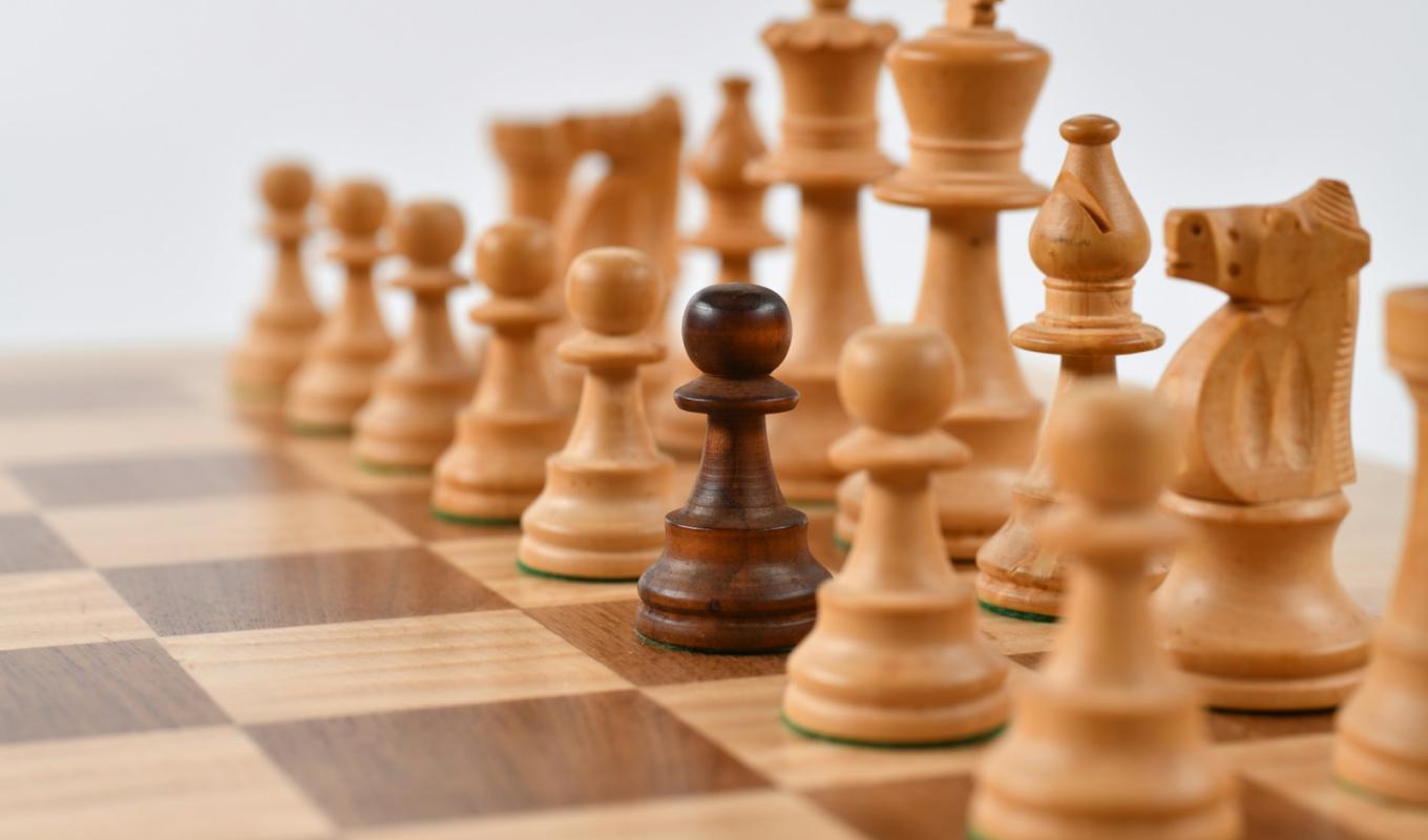 Chess pieces with one dark pawn among light ones — comparing AI models