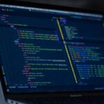Code on a laptop screen — setting up a self-hosted n8n server